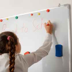 Child writing on board