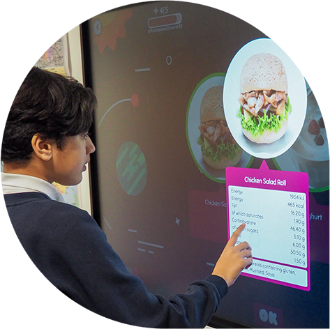 Pupil engaging with meal selection on the classroom whiteboard